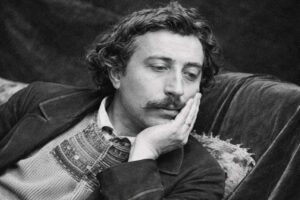 Paul Gauguin: Schwarz-Weiß-Foto des Künstlers, der nachdenklich seinen Kopf auf die Hand stützt.